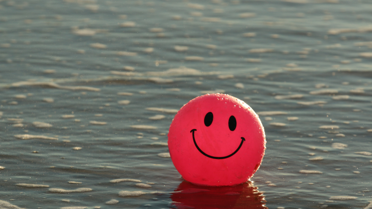 red balloon with smiley face on it